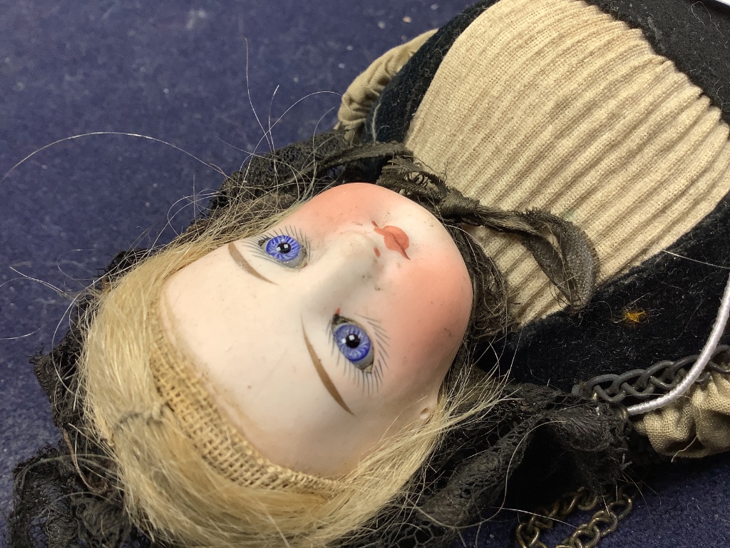 A costume doll, bisque shouler plate, height 25cm